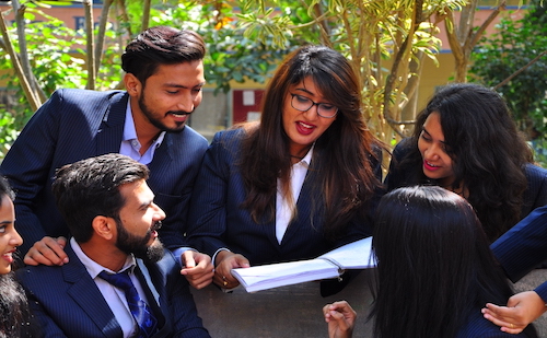 Campus view of students interacting at S-VYASA School of Advanced Studies, located in the Sattva Global City IT Park, Bengaluru, with modern buildings, lush greenery, and state-of-the-art infrastructure in the background.